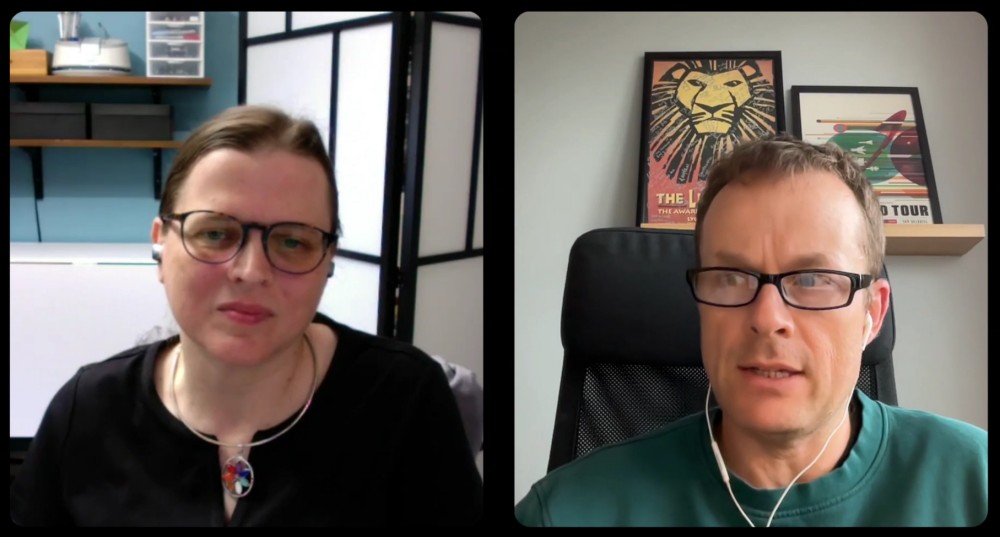 A woman and a man in a web meeting.